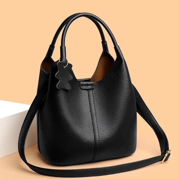 Leather women's bag - 2025 new style, fashionable and versatile, single shoulder crossbody bag with high-end and niche design, handbag in the shape of a water bucket.