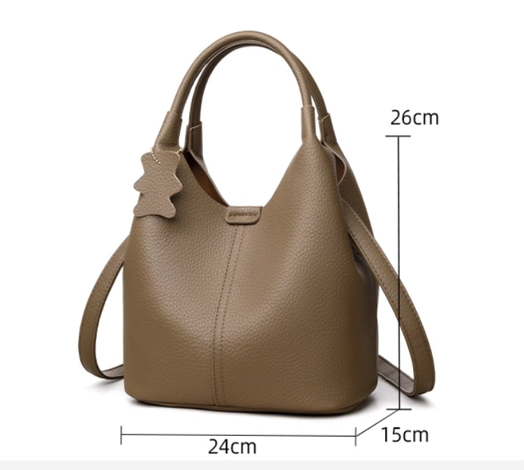 Leather women's bag - 2025 new style, fashionable and versatile, single shoulder crossbody bag with high-end and niche design, handbag in the shape of a water bucket.