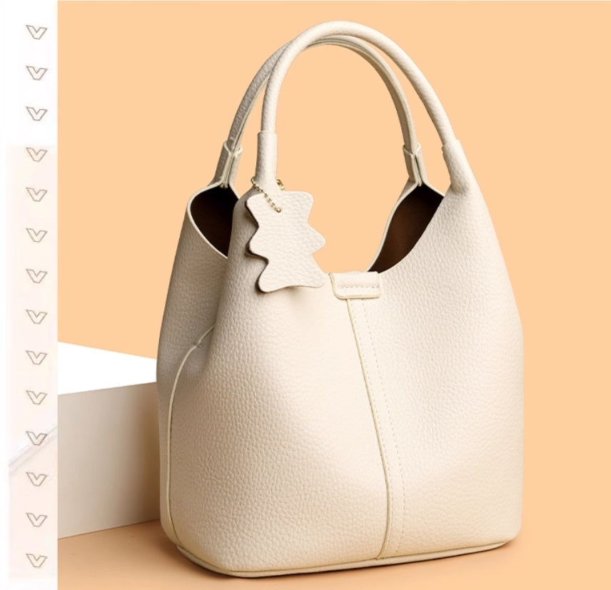 Leather women's bag - 2025 new style, fashionable and versatile, single shoulder crossbody bag with high-end and niche design, handbag in the shape of a water bucket.